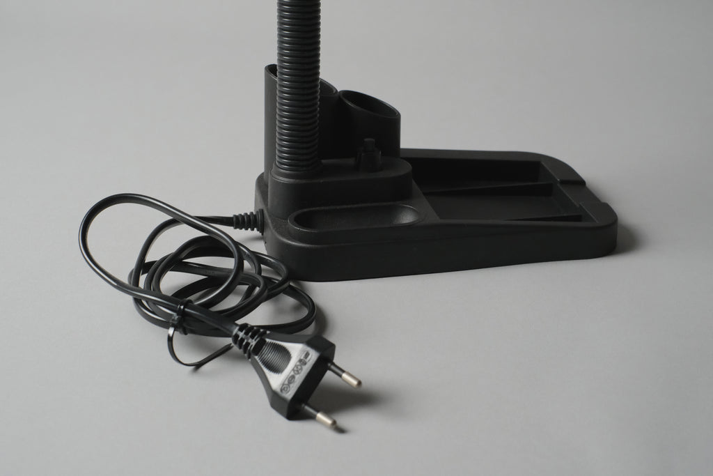 Close-up detail of the built-in stationary caddy, the cord and Euro power plug.
