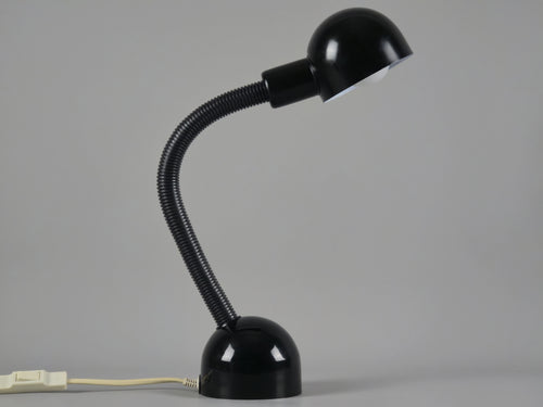 Vintage 1980s Happylight Holland gooseneck desk lamp in black, featuring a postmodern industrial silhouette and flexible neck.