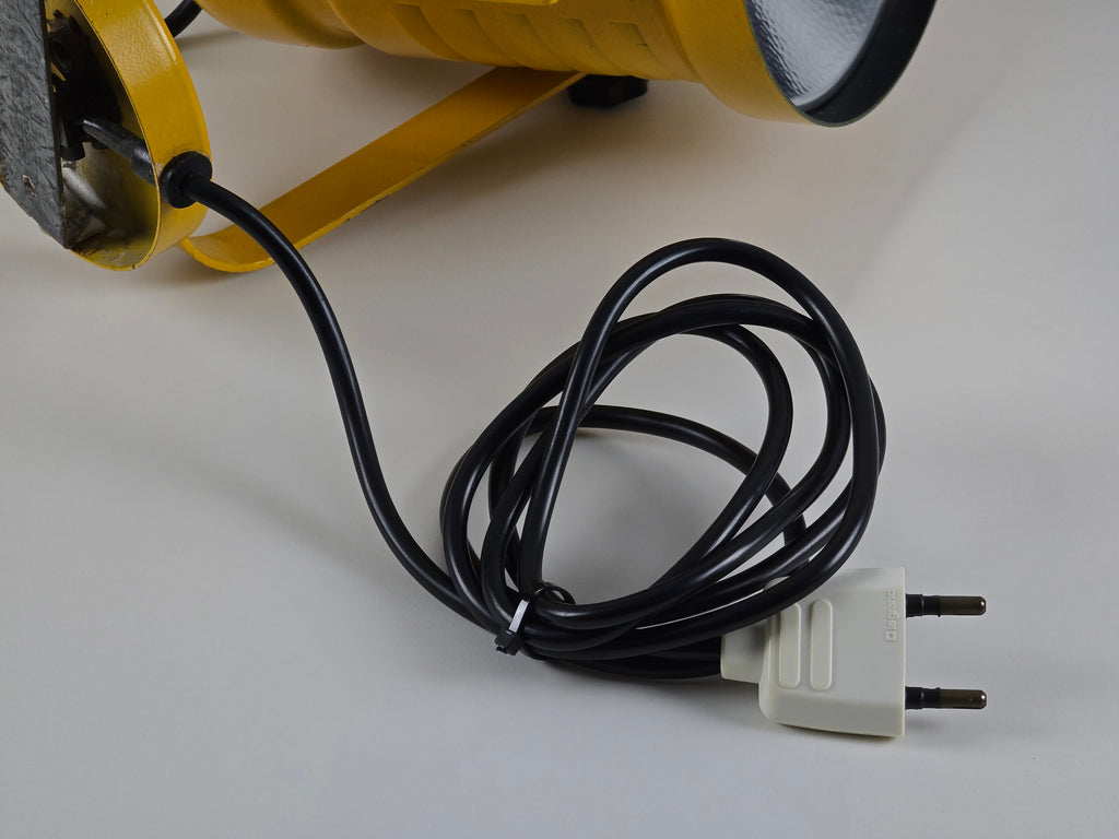 Macro detail of cord and a two-pin Euro power plug.